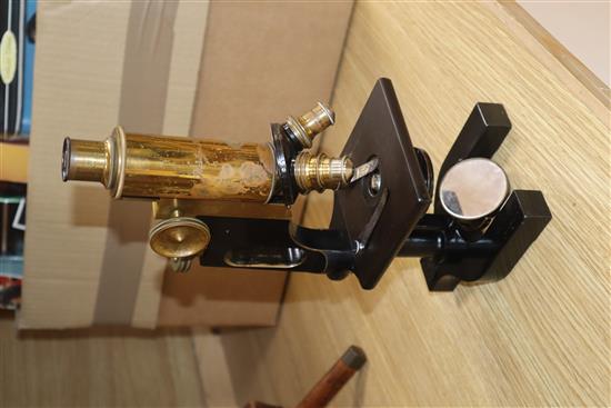 A Bausch & Lomb oak cased microscope